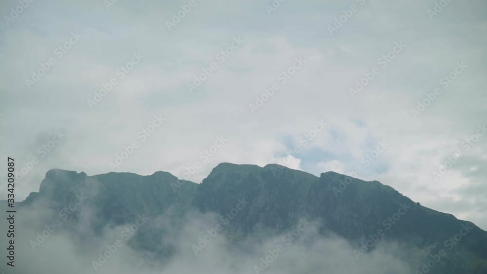day shot of mountains top with fog , foggy mountain peak amazing rural view foggy scary feeling winter mood day shot of mountains top with fog , foggy mountain peak amazing rural view foggy scary feeling winter mood