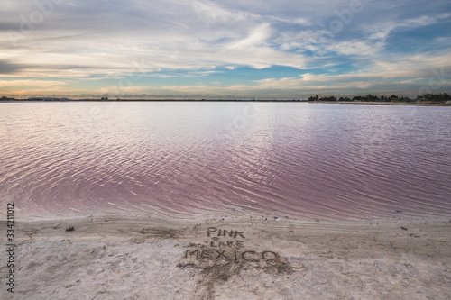 Las Coloradas, salt pink lagoon, beautiful pink water and clear blue sky near Rio Lagartos, Yucatan, Mexico photo