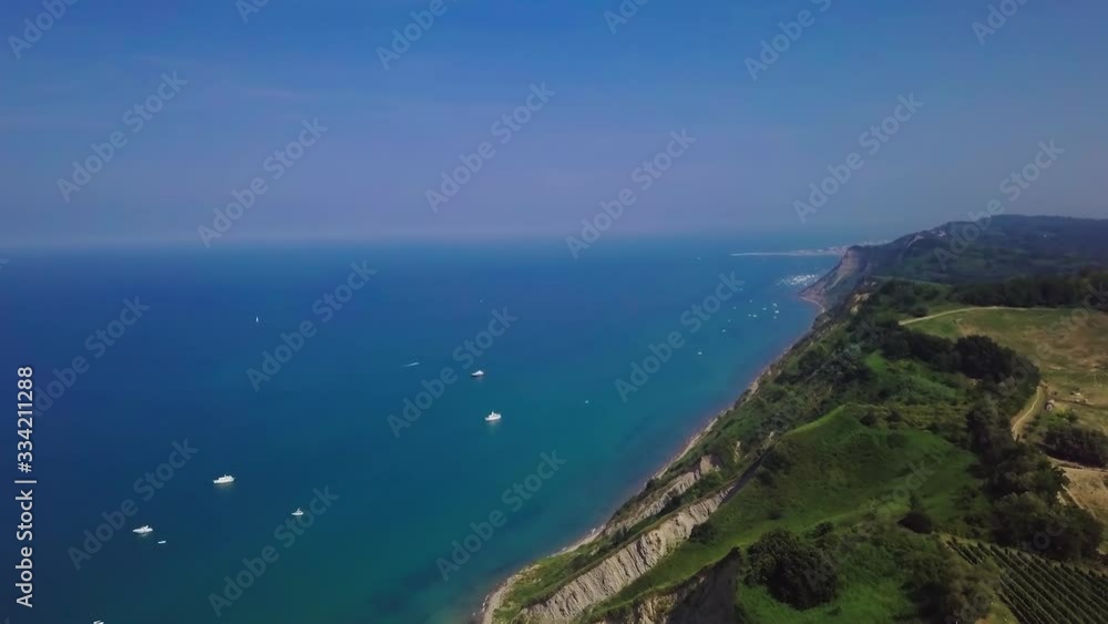 Aerial view at summer sunny day of themedierrenean sea in Italy. Tracers from yachts on the water. 4K Aerial view at summer sunny day of themedierrenean sea in Italy. Tracers from yachts on the water. 4K