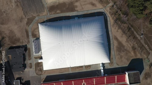 The white dome. White football arena in the form of a huge dome. The dome membrane consists of two layers between which hot air circulates. Exterior of all season sports dome. double fabric membrane photo