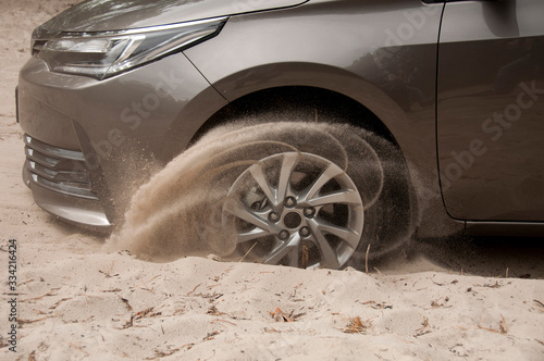 Konstfotografi Car wheels on a sea beach sand