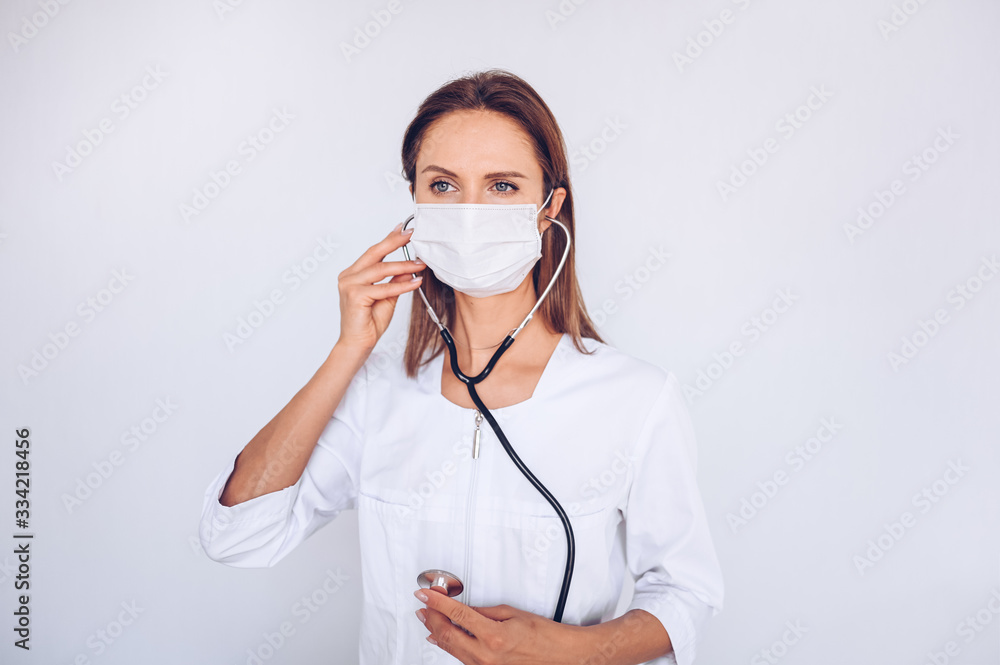 Woman doctor nurse wearing protective mask and stethoscope for check breathing, corona virus prevention, hygiene to stop spreading coronavirus. Avoid contaminating Corona virus Covid-19 concept Woman doctor nurse wearing protective mask and stethoscope for check breathing, corona virus prevention, hygiene to stop spreading coronavirus. Avoid contaminating Corona virus Covid-19 concept