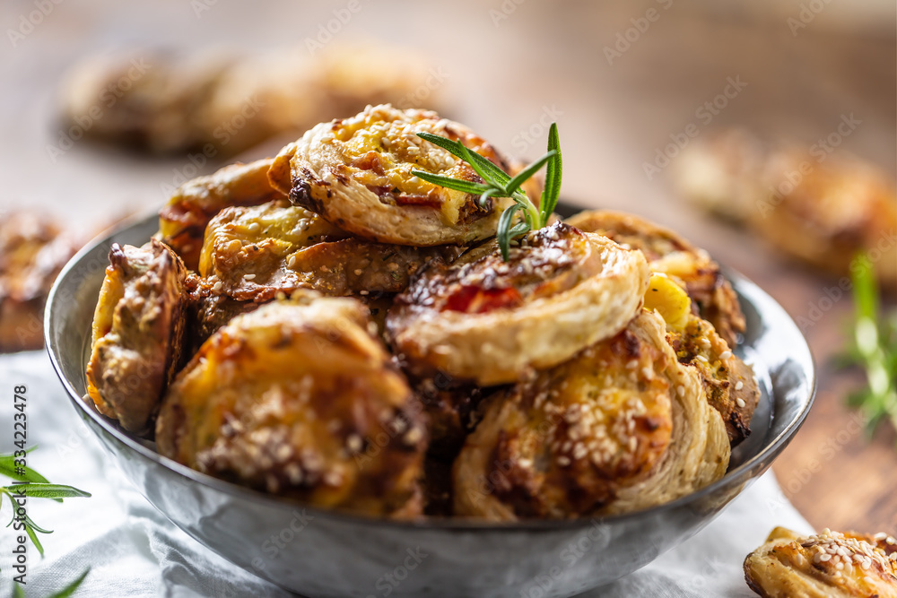 Pizza rolls stuffed with various ingredients, prosciutto bacon spinach basil mozzarella or parmesan cheese Pizza rolls stuffed with various ingredients, prosciutto bacon spinach basil mozzarella or parmesan cheese