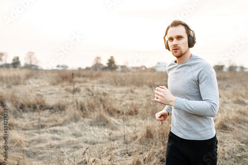 Active lifestyle. Attractive young guy jogging