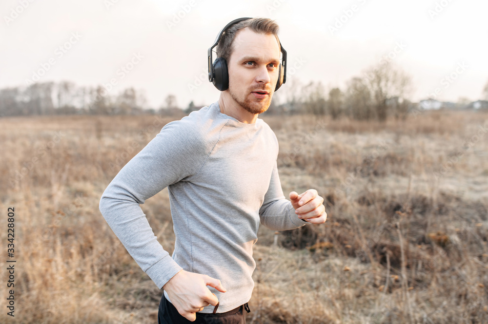 Active lifestyle. Attractive young guy jogging