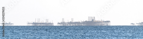 Offshore oil drilling platform in sea © Vastram
