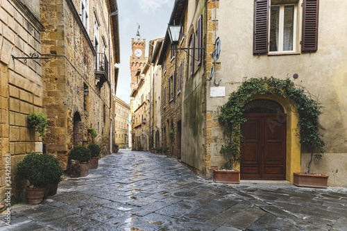 Fototapeta Naklejka Na Ścianę i Meble -  Walk on a rainy day through the streets of the beautiful town, Pienza, Tuscany