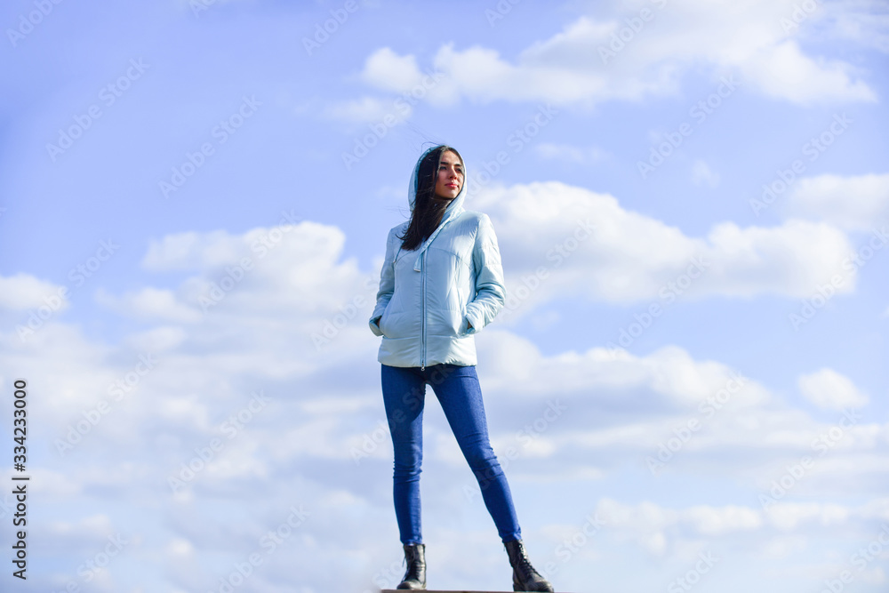 above the clouds. looking far away, sense of freedom. future and success. lifestyle concept. trendy girl in casual fall coat. autumn and spring style. Young and beautiful woman over sky background above the clouds. looking far away, sense of freedom. future and success. lifestyle concept. trendy girl in casual fall coat. autumn and spring style. Young and beautiful woman over sky background