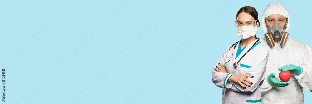 Two doctors on the light blue background. Two doctors on the light blue background.