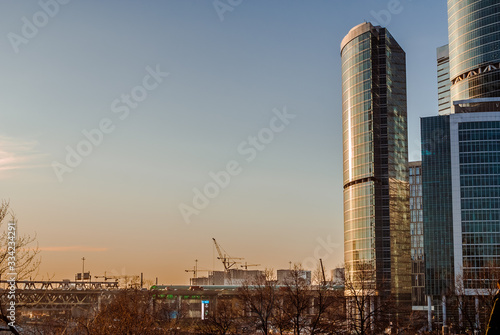 Scenic view with skyscrapers of the Moscow City International Business Center. Early morning view on high rise modern buildings and tower cranes on the horizon.