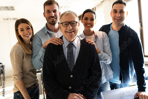 Group portrait of professor with his students. photo