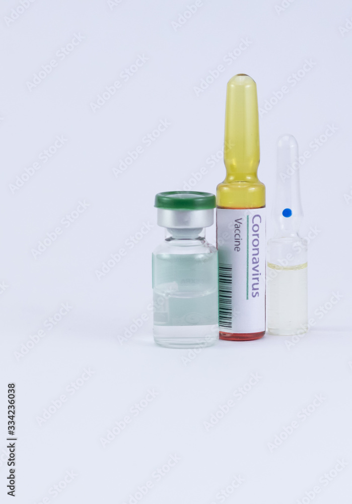 Two generic ampoules with one having Corona Virus Vaccine label and an a medicine vial for its cure. Two generic ampoules with one having Corona Virus Vaccine label and an a medicine vial for its cure.