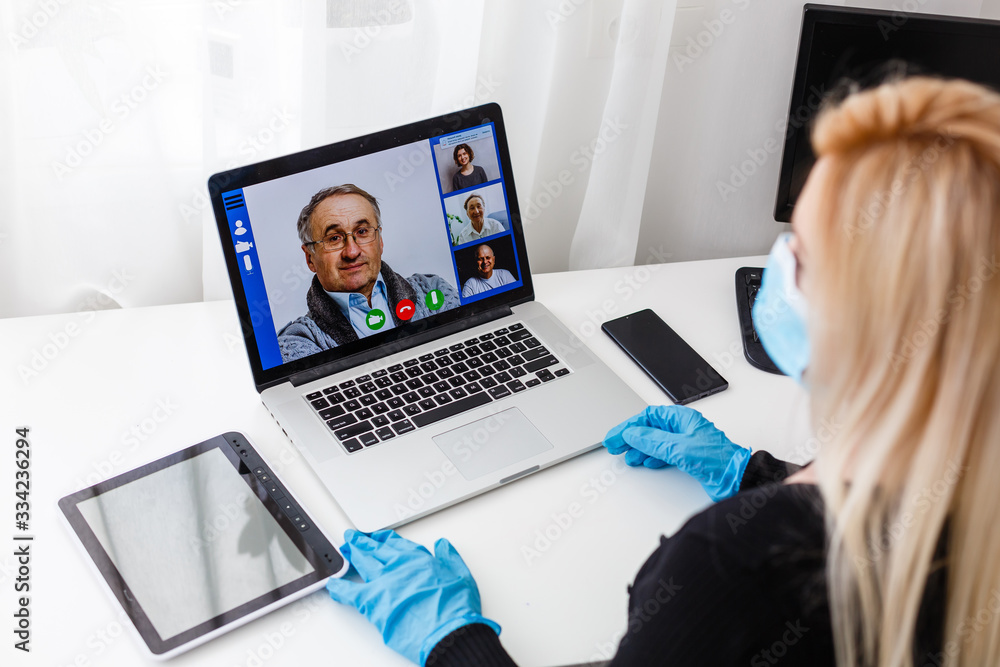Teacher, tutor or professor with headset, laptop and camera in her office explaining something at an online lesson or video lecture, webinar Teacher, tutor or professor with headset, laptop and camera in her office explaining something at an online lesson or video lecture, webinar