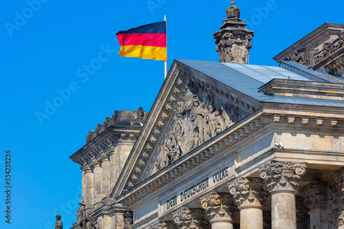Photography Berlin Reichstag with waving german flag, german politic democracy government bu