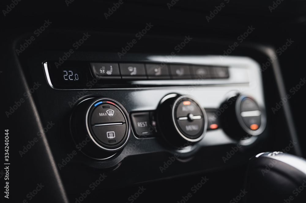 Color detail with the air conditioning button inside a car. Car interior. Car air condition. Color detail with the air conditioning button inside a car. Car interior. Car air condition.