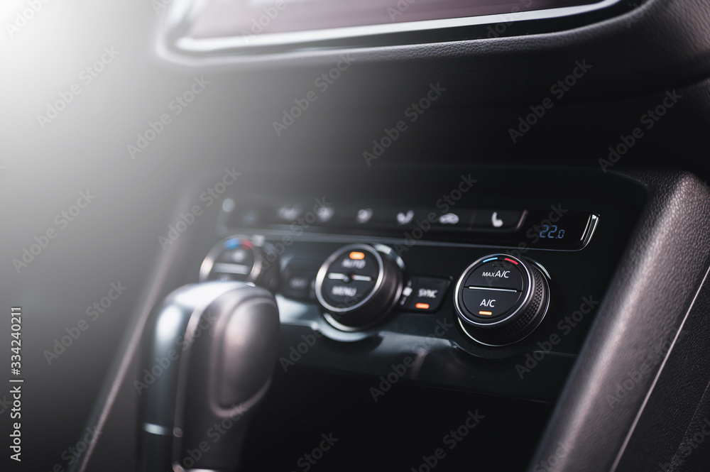 Color detail with the air conditioning button inside a car. Car interior. Car air condition. Color detail with the air conditioning button inside a car. Car interior. Car air condition.