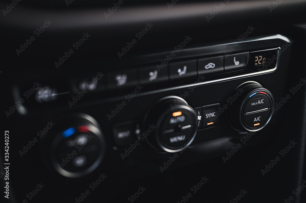 Color detail with the air conditioning button inside a car. Car interior. Car air condition. Color detail with the air conditioning button inside a car. Car interior. Car air condition.