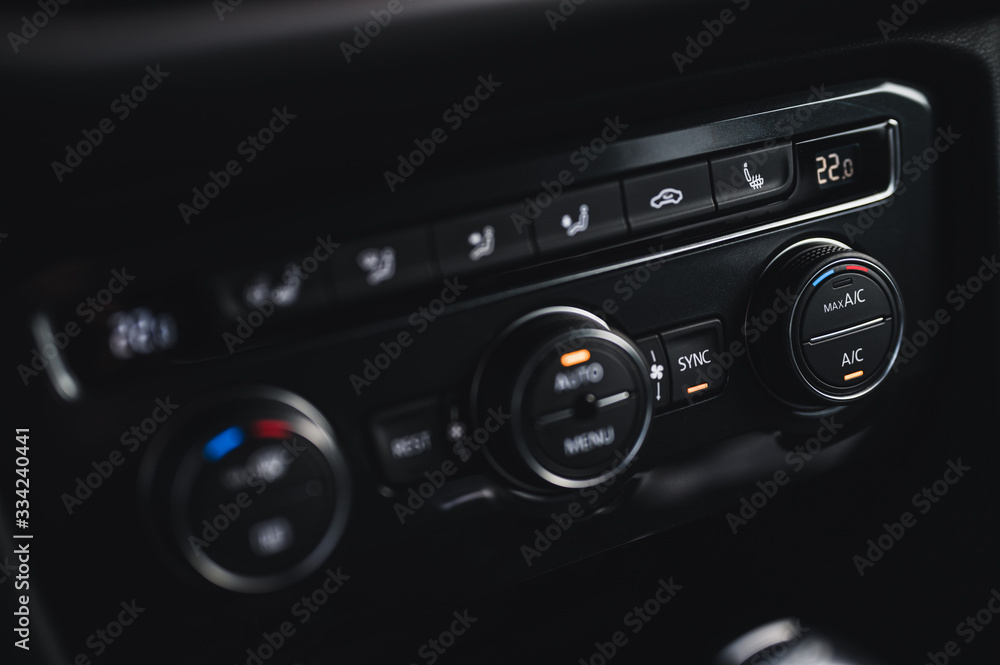 Color detail with the air conditioning button inside a car. Car interior. Car air condition. Color detail with the air conditioning button inside a car. Car interior. Car air condition.