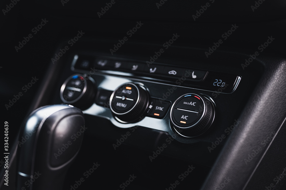 Color detail with the air conditioning button inside a car. Car interior. Car air condition. Color detail with the air conditioning button inside a car. Car interior. Car air condition.