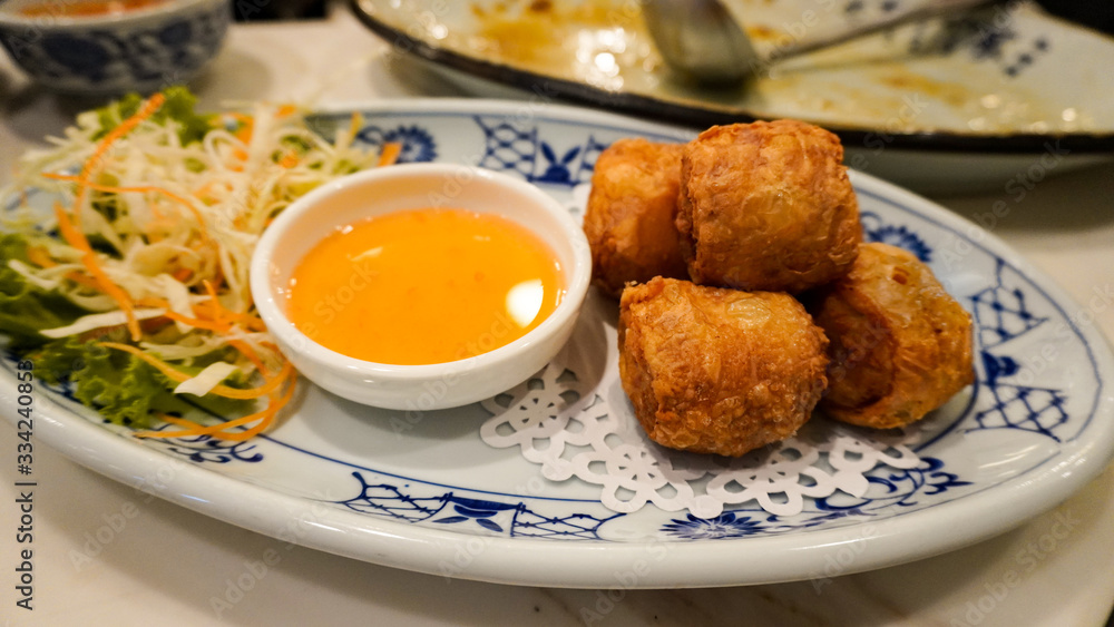 Deep Fried Crab Meat Rolls or Hoi Jo. Traditional local Chinese food for appetizer. (selective focus) 