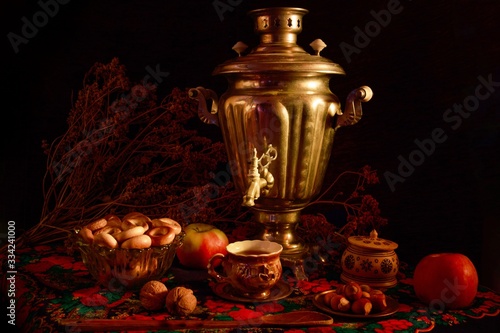 Canvas Print Closeup shot of a samovar in a beautiful interior setting on a black background