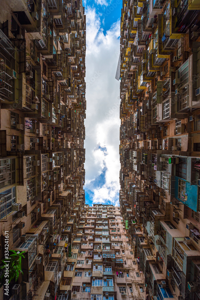 Old apartments at blue sky in Hong Kong.