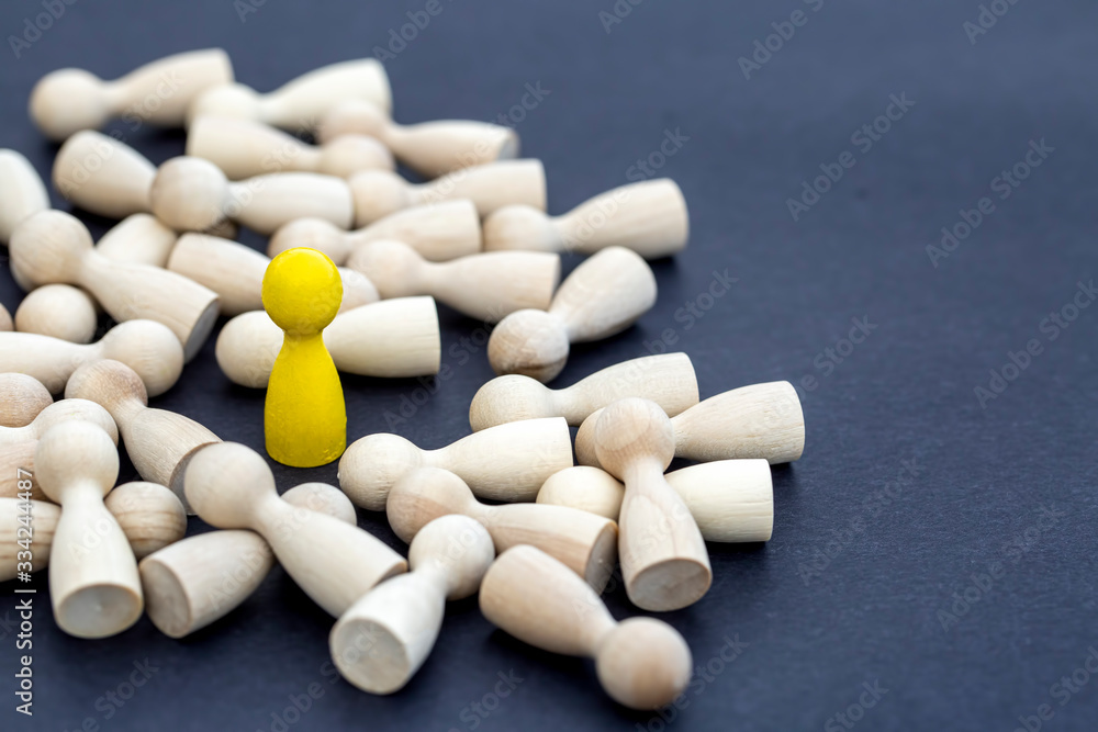 Personal development. Wooden figure in a crowd. Think different. Personal development. Wooden figure in a crowd. Think different.