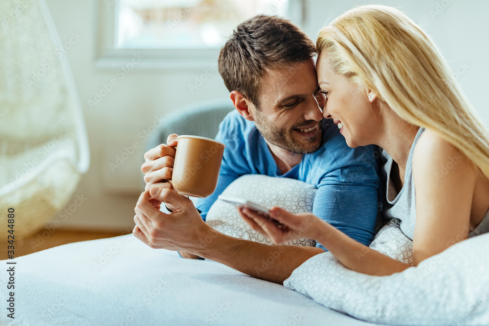 Happy couple in love enjoying in morning time in the bedroom. Happy couple in love enjoying in morning time in the bedroom.
