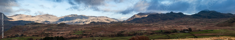 A five image panorama of the Lake District Southern Fells, with Harter Fell right of centre and Scafell on the left, Cumbria, England.