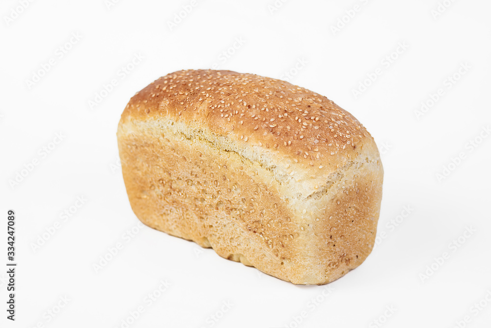 Bakery product. Fresh white molded bread with sesame seeds isolated on white background. Top view and copy space for text. Bakery product. Fresh white molded bread with sesame seeds isolated on white background. Top view and copy space for text.