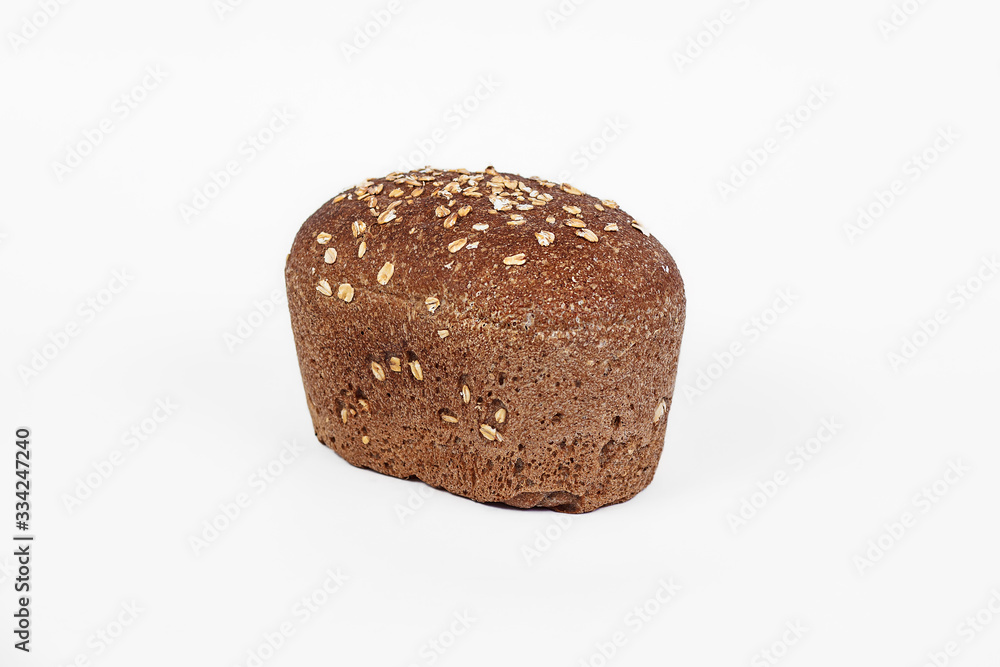 Fresh bakery product. Bread. Cereal bun with bran, sunflower and flax seeds isolated on white background. Top view and copy space for text. Fresh bakery product. Bread. Cereal bun with bran, sunflower and flax seeds isolated on white background. Top view and copy space for text.