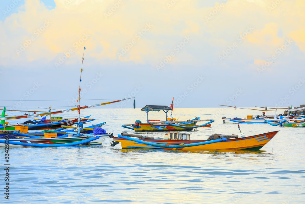 Colorful handcrafted Balinese wooden fishing boat at port in Jimbaran beach, Bali	