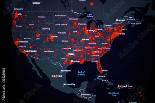 United States, West Coast. Coronavirus COVID-19 global cases Map. Red Point showing the number of infected.. World map on monitor display.