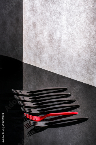 Still life with red and black forks