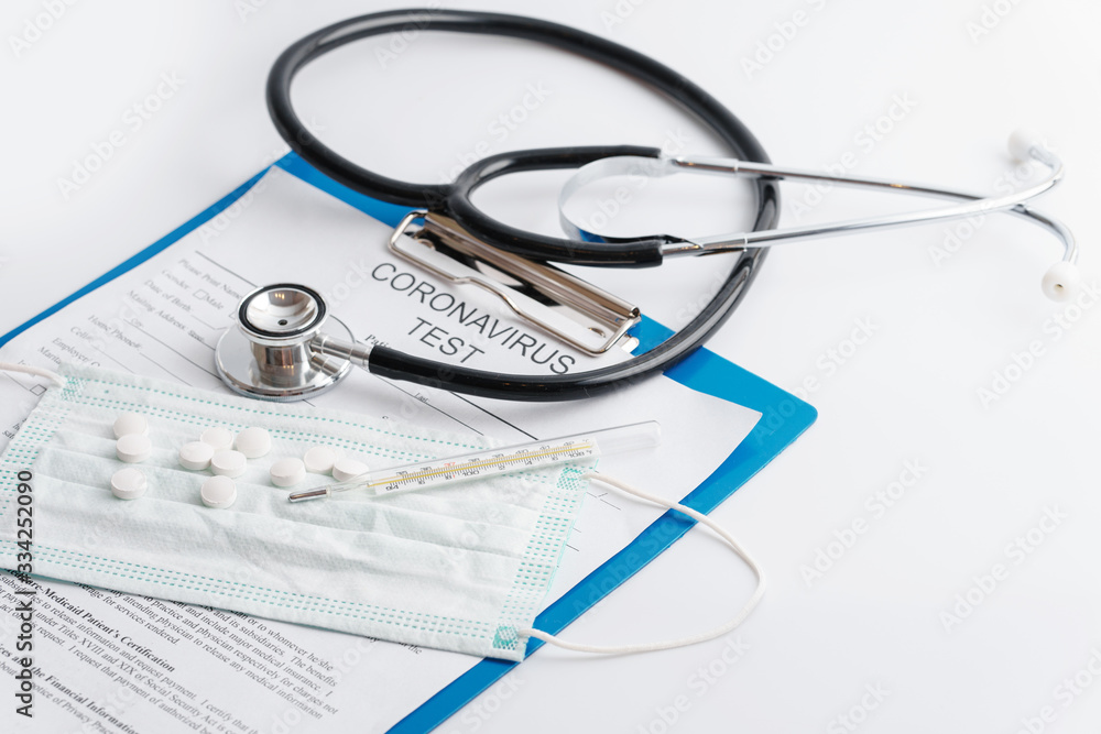 Stethoscope, thermometer and folder with documents Stethoscope, thermometer and folder with documents