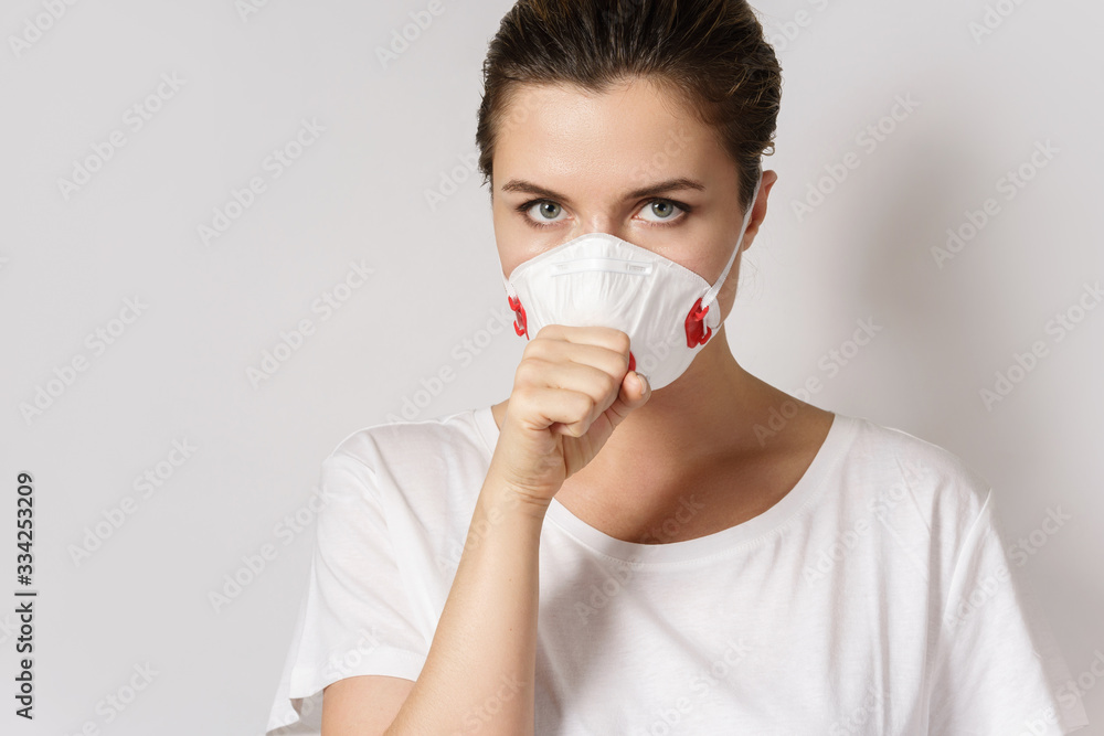 Young woman is wearing a face mask for protection against virus Young woman is wearing a face mask for protection against virus