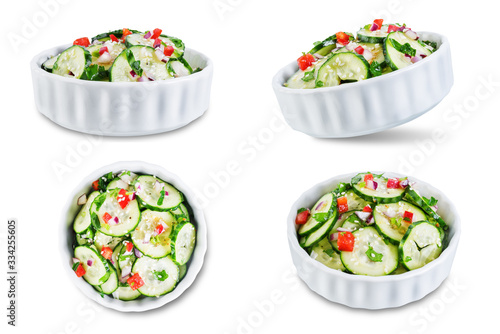 Cucumber spice salad with red onion nd red pepper on a white isolated background