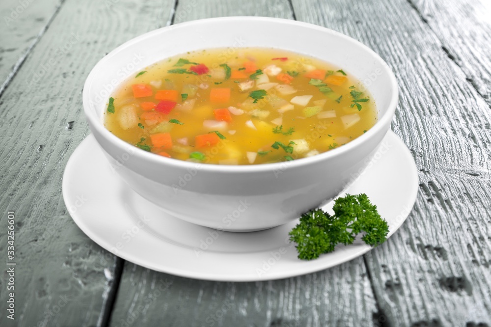 Bowl of delicious vegetable soup on a table Bowl of delicious vegetable soup on a table