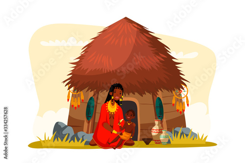 African tribal woman sitting with child near hut