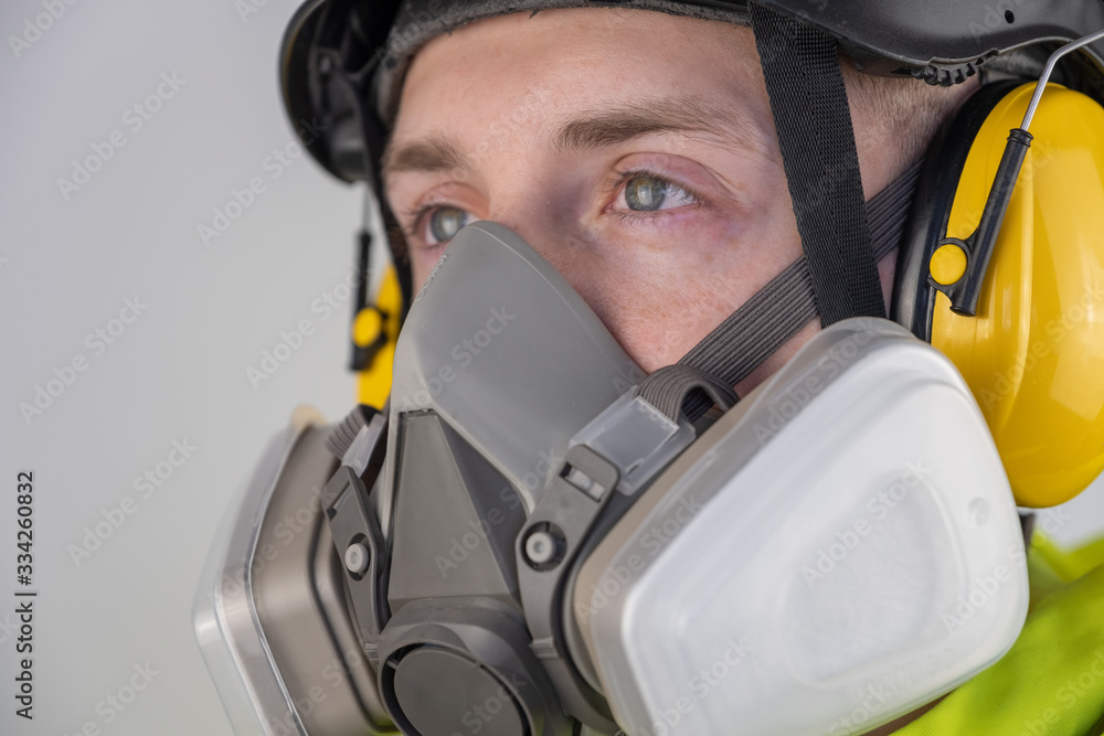 Man in personal protective equipment at work Man in personal protective equipment at work