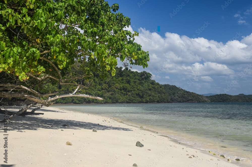 Island Hopping in Langkawi. Familly vacation and tours in Malaysia. Scenic views of small green rocky islands from the boat on Andaman Sea. Island Hopping in Langkawi. Familly vacation and tours in Malaysia. Scenic views of small green rocky islands from the boat on Andaman Sea.