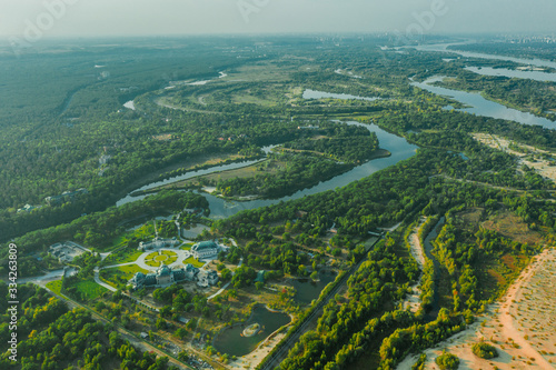 Palace of Ukrainian businessman in a beautiful landscape on the river in a green valley - Aerial view
