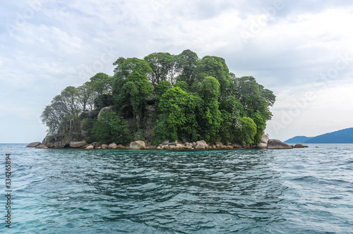 Tropical island with cloudy scene