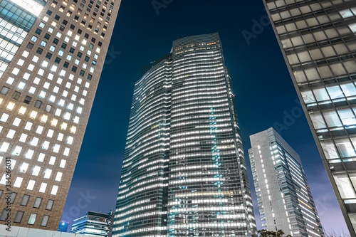 Low angle of the Shiodome City Center at night in the Shiodome area of Minato, Tokyo, Japan