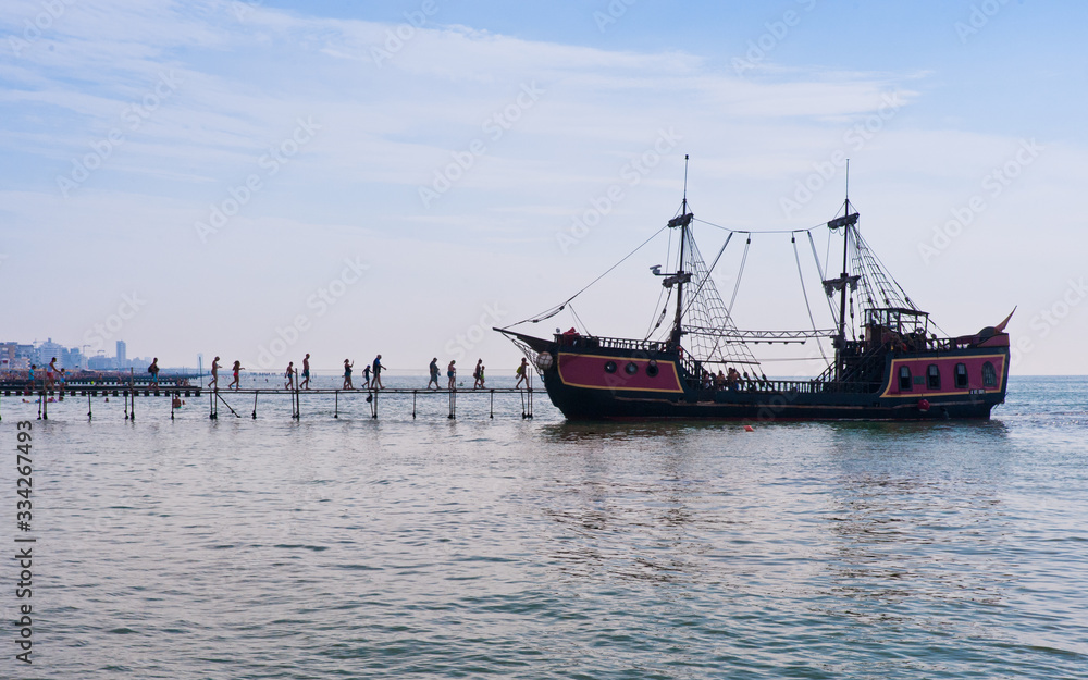 A fake pirate ship awaits its load of tourists to take them on a visit to the coast of the city of Jesolo, a seaside resort in the Veneto region, north east of Italy.