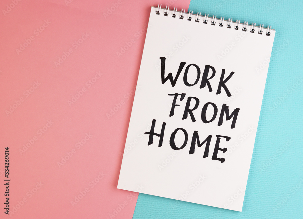 white notebook with the text work at home, top view