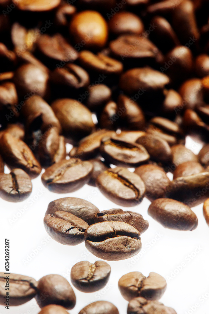 Roasted coffee beans on a table Roasted coffee beans on a table