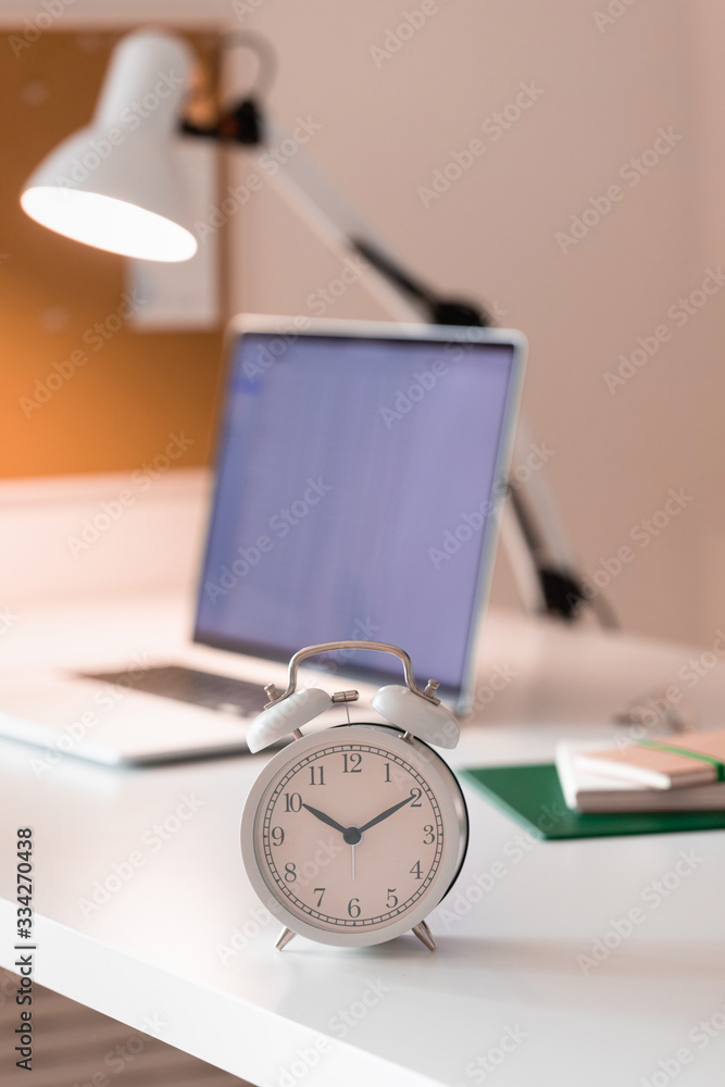Workplace with alarm clock in modern style. Business communication concept. Home office workplace. Workplace with alarm clock in modern style. Business communication concept. Home office workplace.