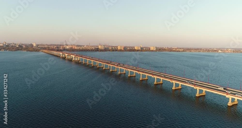 Wallpaper Mural Aerial drone view of long bridge that crosses the blue river Dnepro in city Dnepr in Ukraine.Beautiful view from the high of river and bridge on sunny weather. Torontodigital.ca