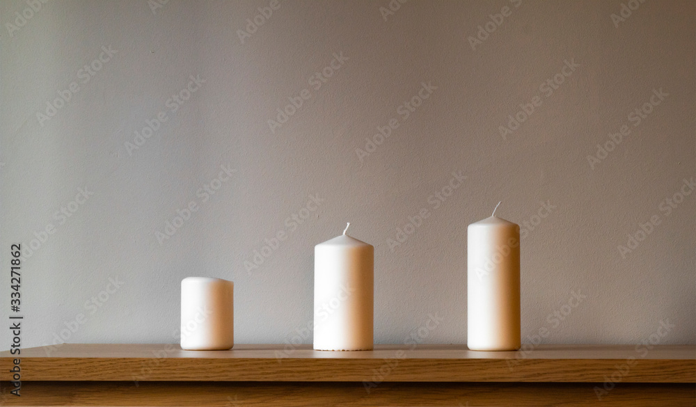 Three candles on the wood table Three candles on the wood table